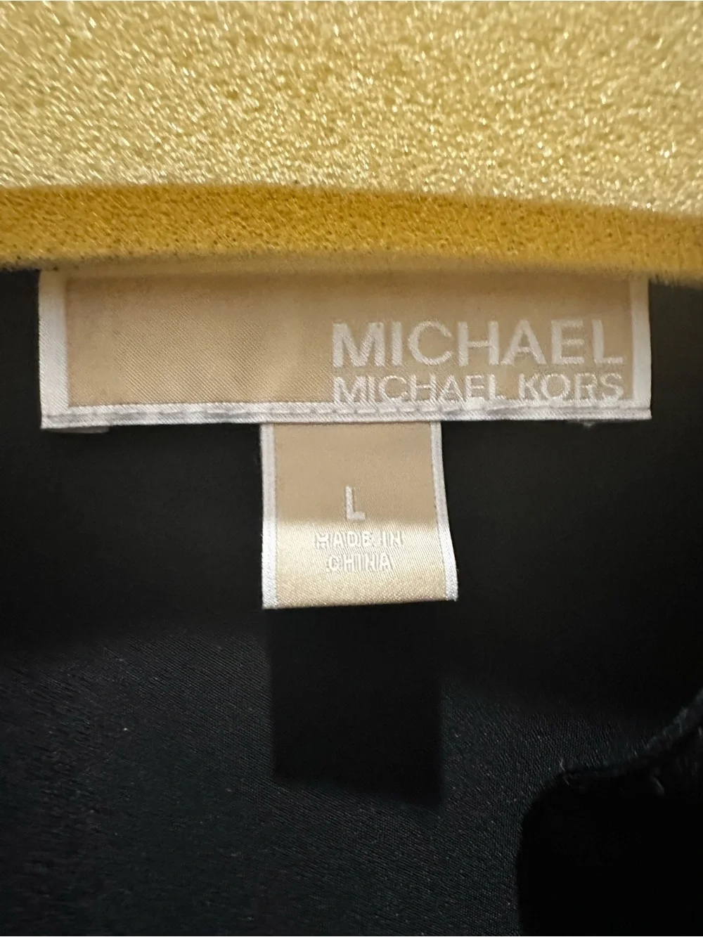 Michael Kors Women’s black shirt with gold zipper detailing
